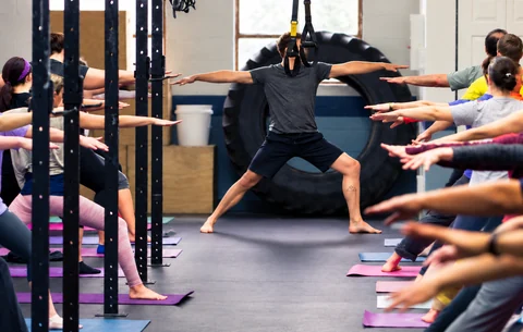 Instructor leading a group movement class